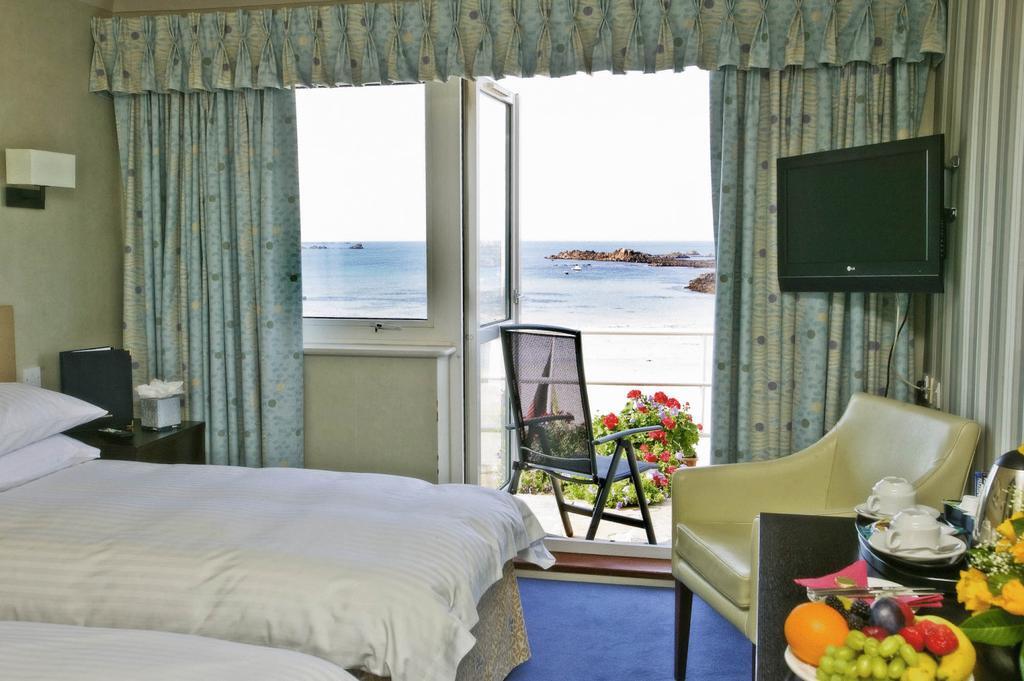 Cobo Bay Hotel Castel Kamer foto